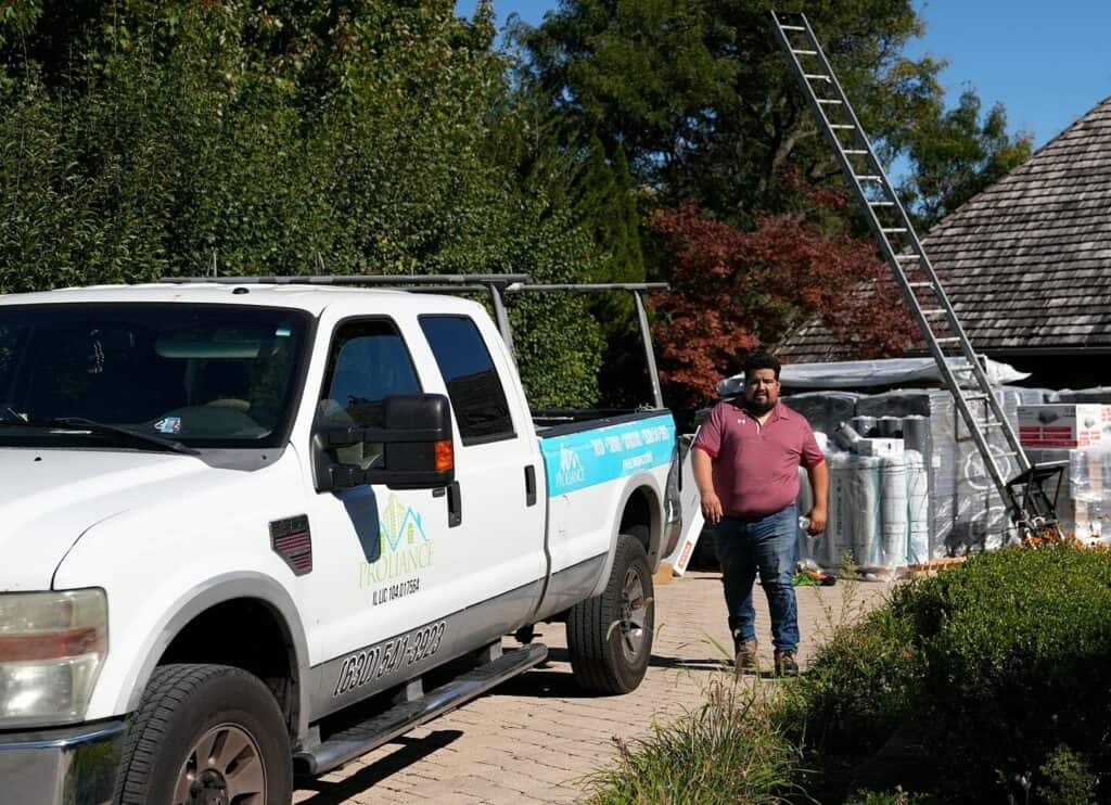 Proliance General Contractors truck at a roof replacement job in Oak Brook, IL